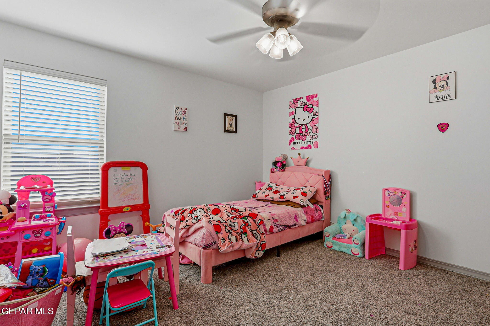 12892 Jonathan Raul El Paso, TX 79928 - Photo 47 of 53 a bedroom with a bed and a chandelier