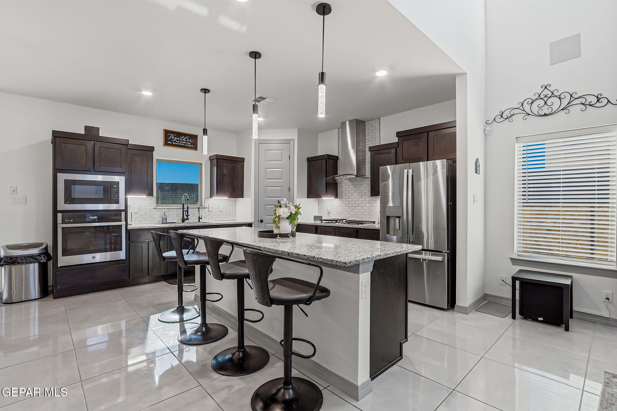12892 Jonathan Raul El Paso, TX 79928 - Photo 7 of 53 a kitchen with stainless steel appliances kitchen island granite countertop a sink and a refrigerator
