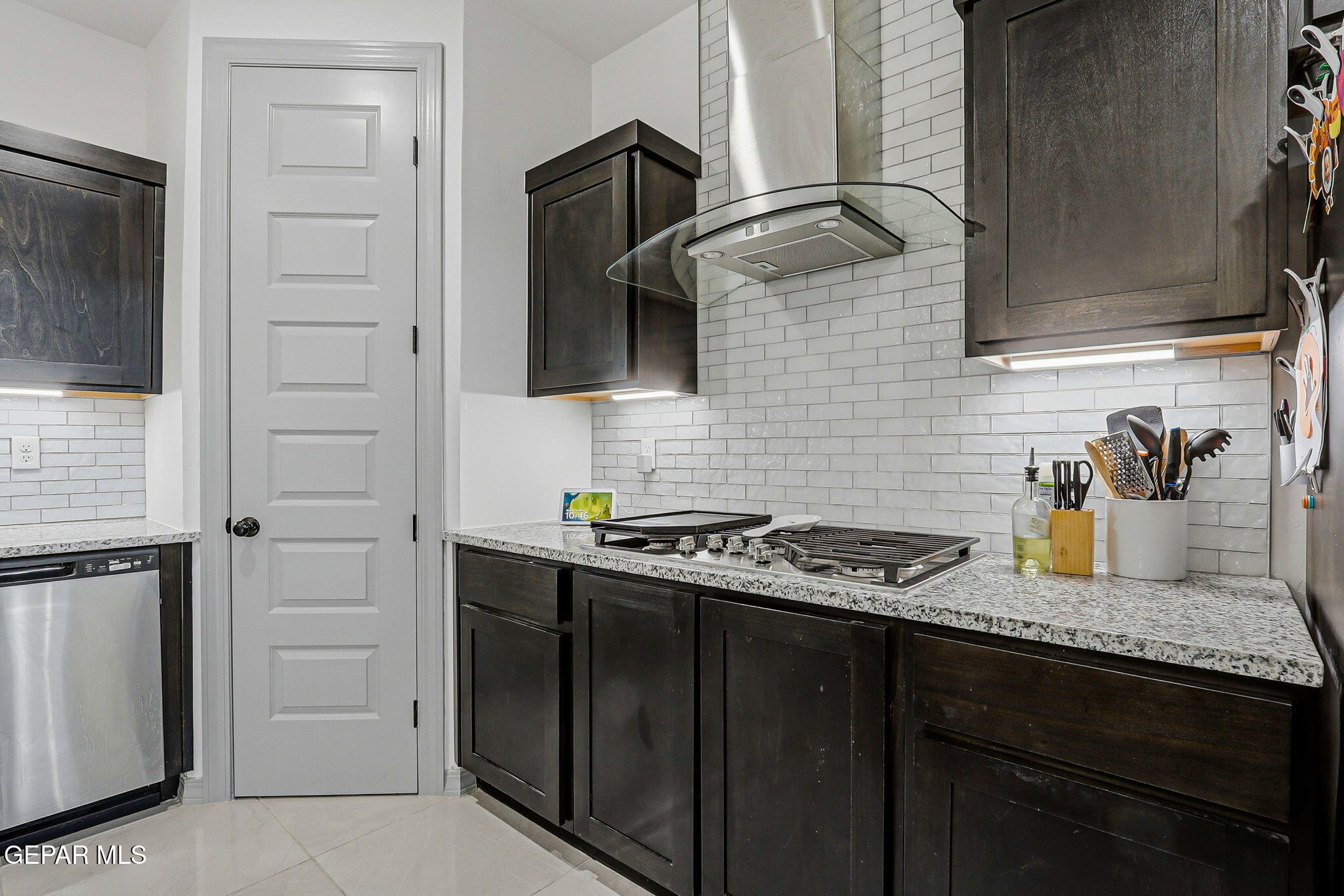 12892 Jonathan Raul El Paso, TX 79928 - Photo 9 of 53 a kitchen with stainless steel appliances granite countertop a sink stove and cabinets