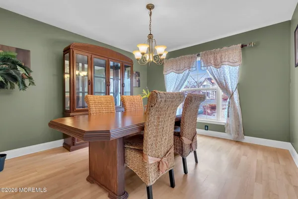 a view of a dining room with furniture and window