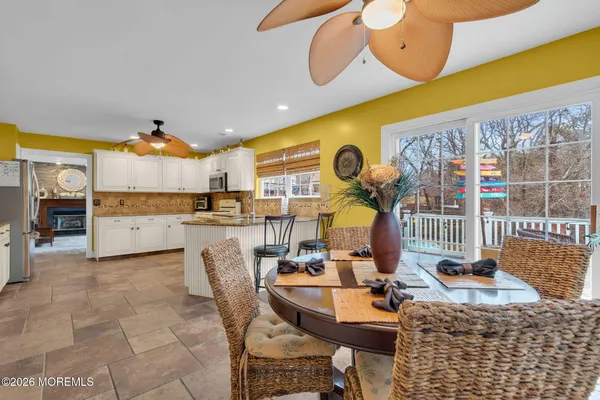 a kitchen with stainless steel appliances granite countertop a stove and a microwave