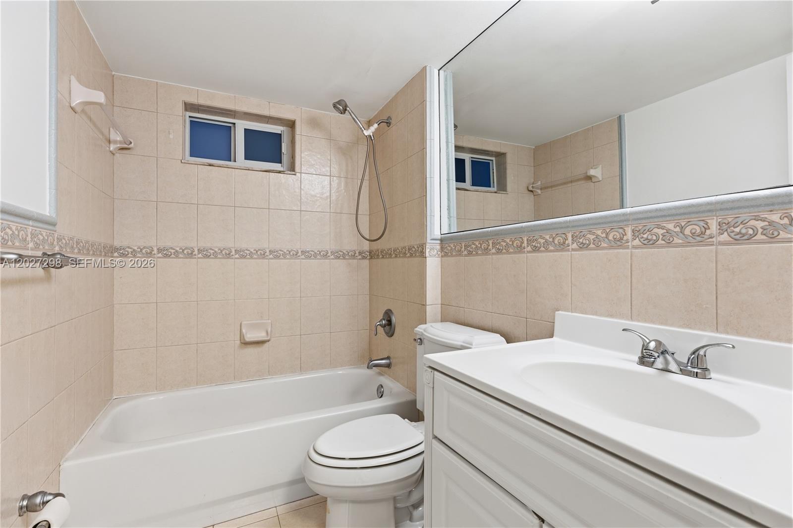 1665 Bay Road, Unit 322 Miami Beach, FL 33139 - Photo 15 of 24 a bathroom with a sink toilet and shower