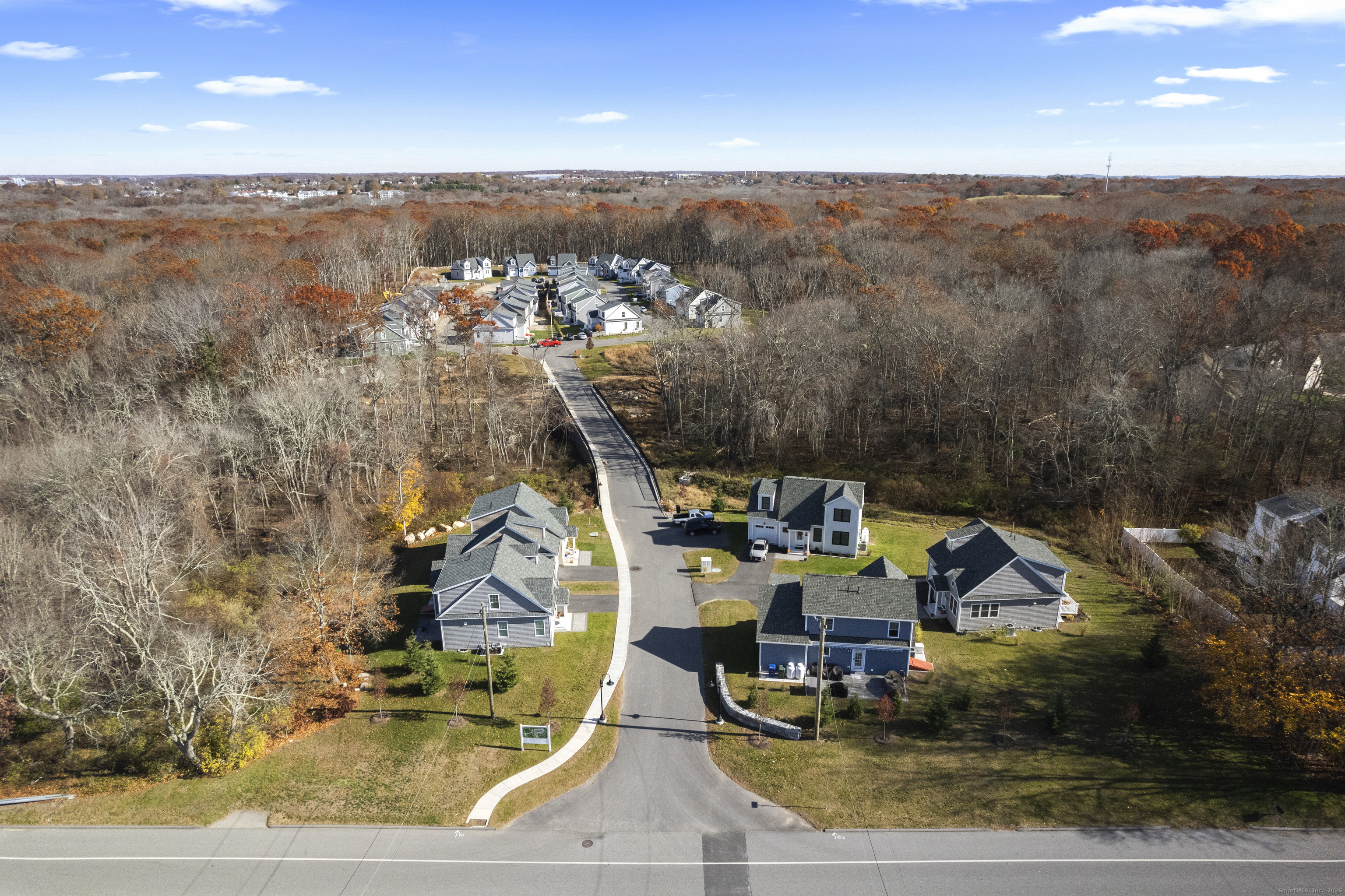 11 Ivy Hill Road, Unit 11 Ridgefield, CT 06877 - Photo 2 of 8 a view of a ocean with a mountain in the background