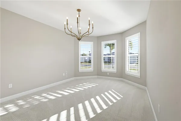 a view of empty room with windows