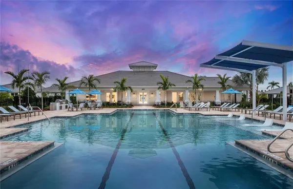 a view of a swimming pool with a patio