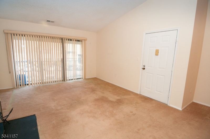 48 Taylor Road Franklin, NJ 07416 - Photo 2 of 25 a view of an empty room with a window