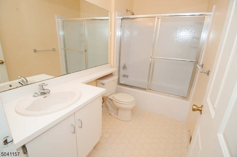48 Taylor Road Franklin, NJ 07416 - Photo 13 of 25 a bathroom with a sink a toilet and shower