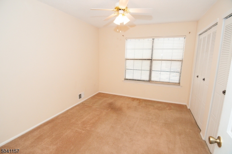48 Taylor Road Franklin, NJ 07416 - Photo 14 of 25 an empty room with windows and fan