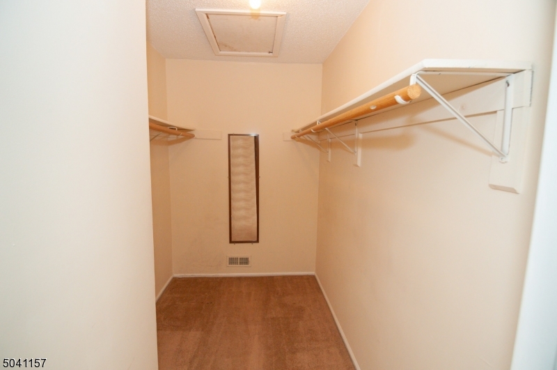 48 Taylor Road Franklin, NJ 07416 - Photo 20 of 25 a view of walk in closet with empty racks
