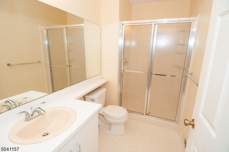 48 Taylor Road Franklin, NJ 07416 - Photo 21 of 25 a bathroom with a sink a toilet and shower