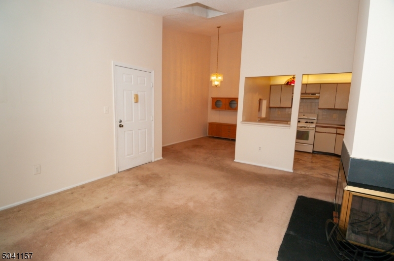 48 Taylor Road Franklin, NJ 07416 - Photo 4 of 25 an empty room with kitchen and sink