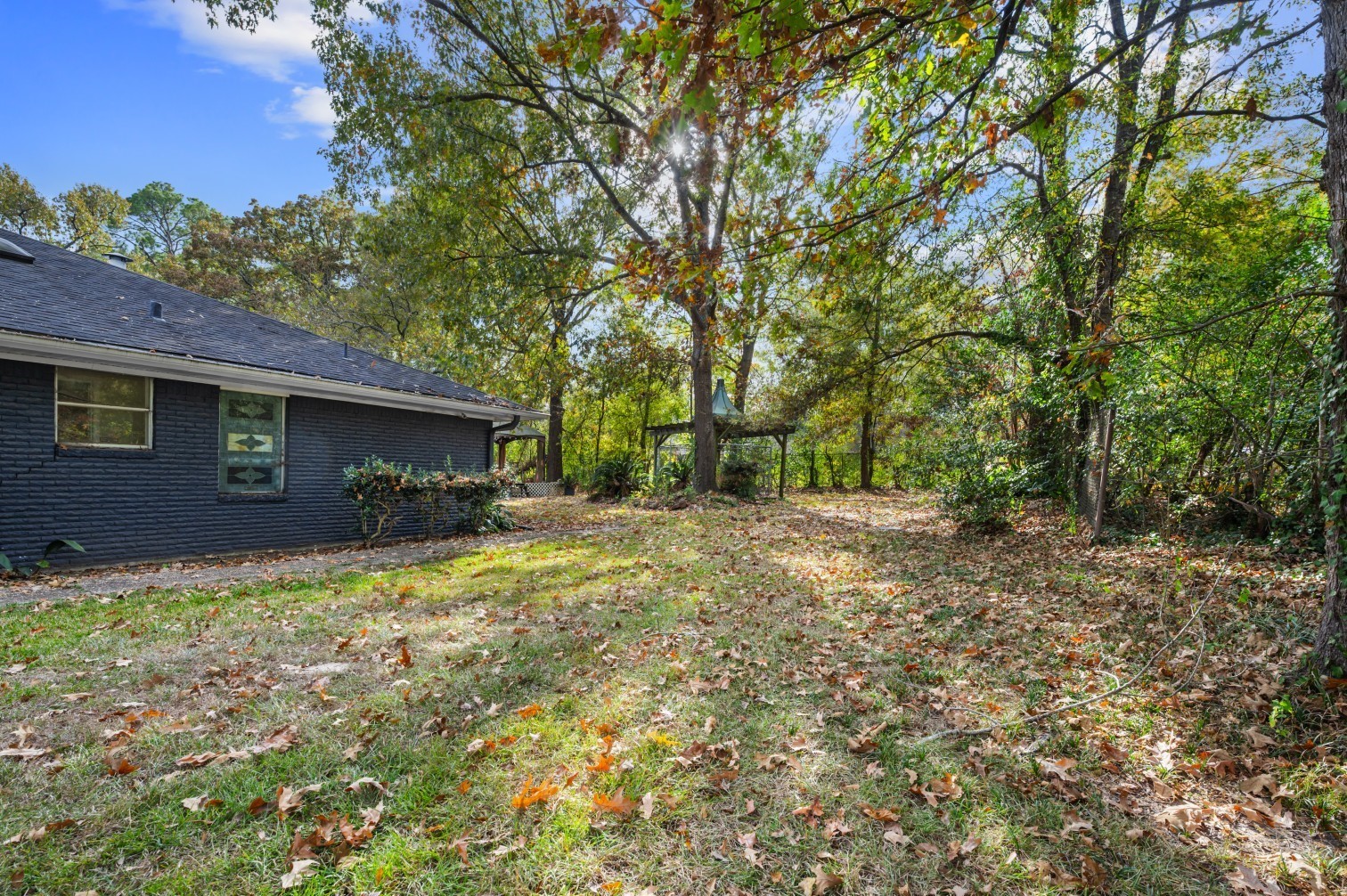 1207 Glade Street Lufkin, TX 75901 - Photo 20 of 49 a view of a house with yard and a tree