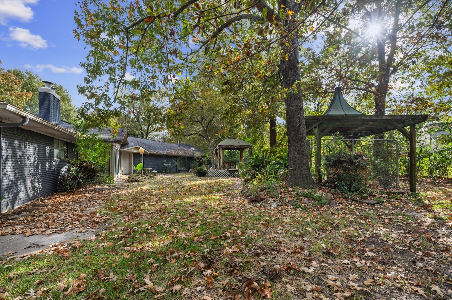 1207 Glade Street Lufkin, TX 75901 - Photo 21 of 49 a tree in front of a white house