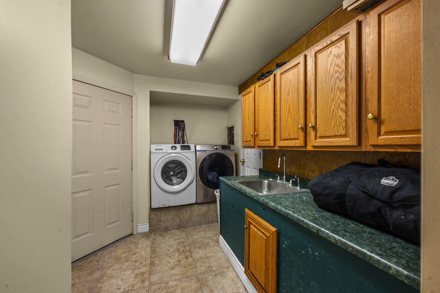 1207 Glade Street Lufkin, TX 75901 - Photo 47 of 49 a kitchen with a window a washer and dryer