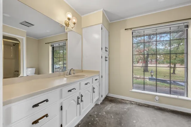 a bathroom with a double vanity sink and a mirror