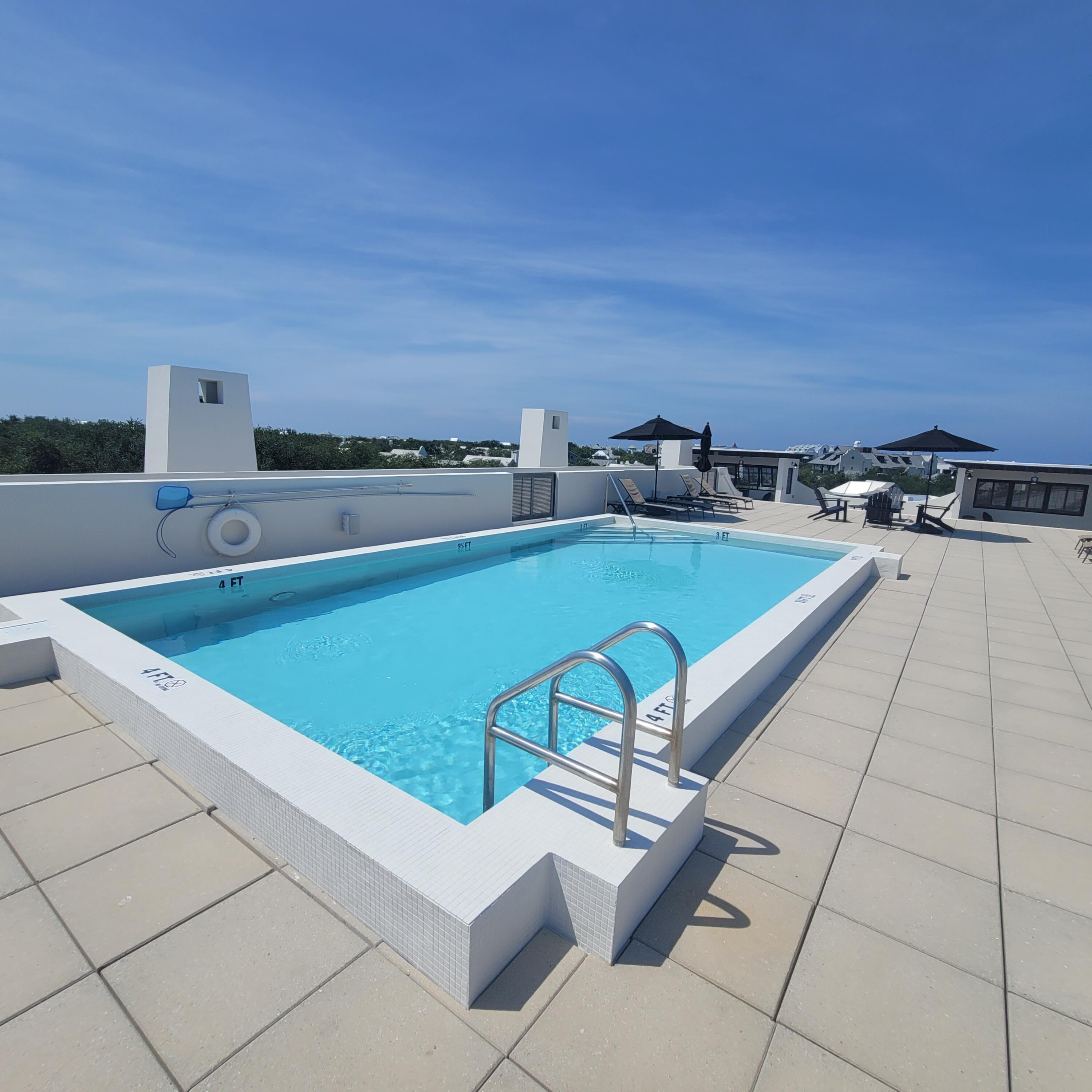 136 Georgetown Avenue, Unit 2C 5 Inlet Beach, FL 32461 - Photo 1 of 18 a view of a terrace with chairs