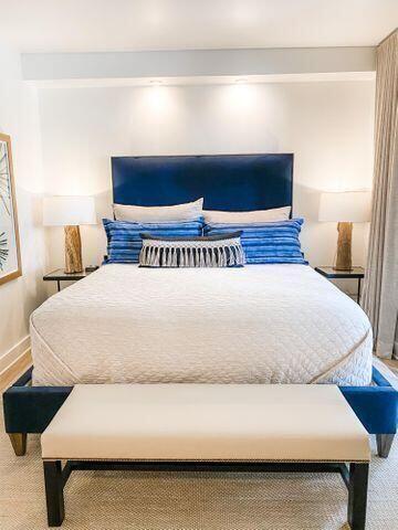 136 Georgetown Avenue, Unit 2C 5 Inlet Beach, FL 32461 - Photo 12 of 18 a large bed sitting in a bedroom next to a lamp