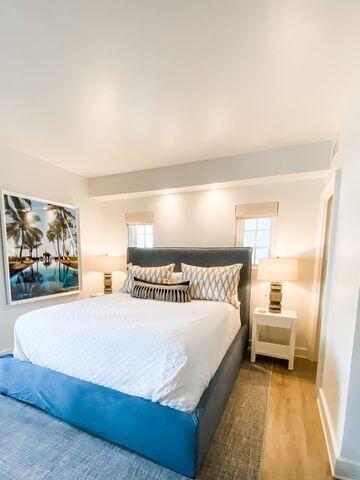 136 Georgetown Avenue, Unit 2C 5 Inlet Beach, FL 32461 - Photo 13 of 18 a bedroom with a bed and a painting on the wall