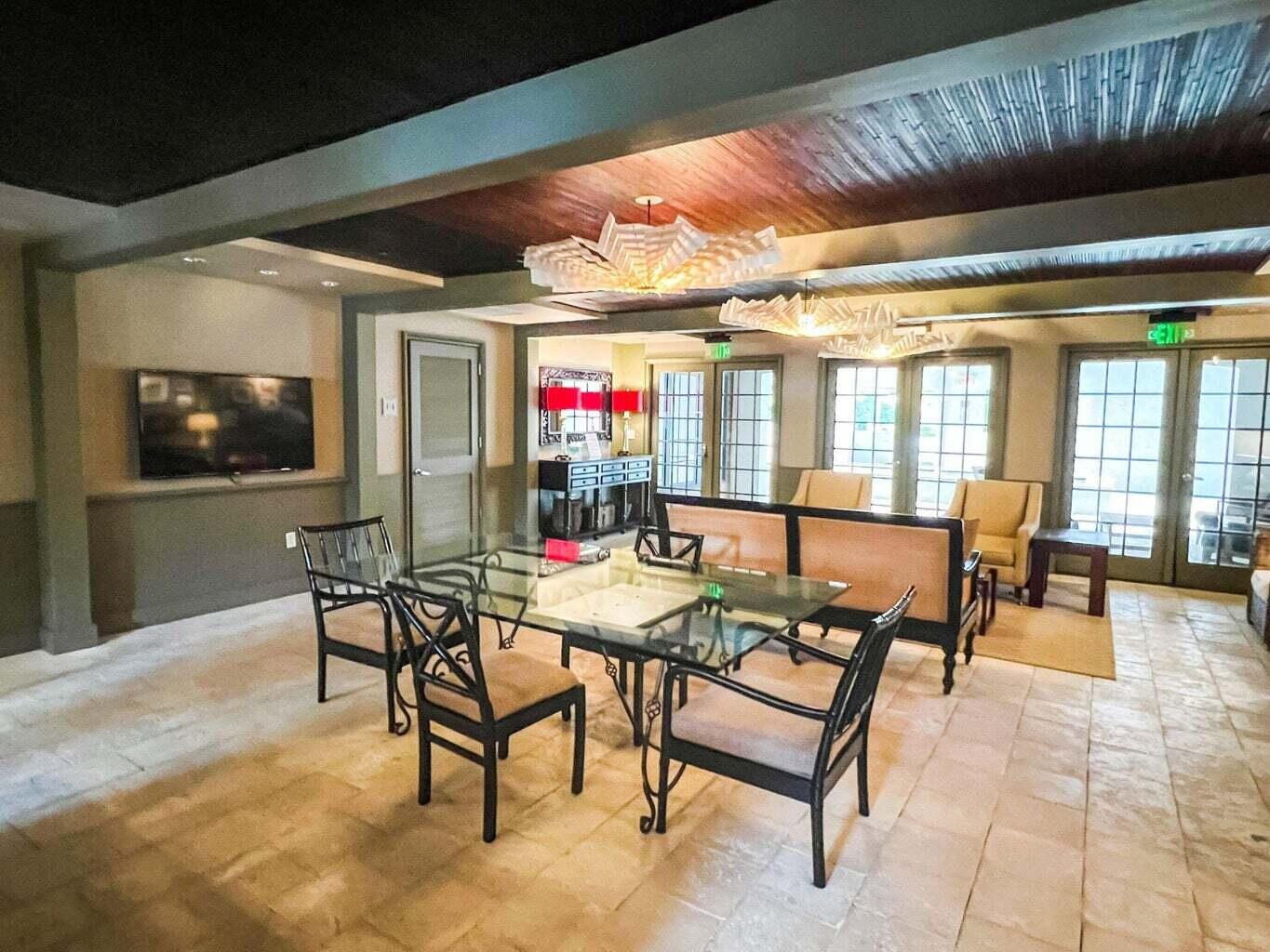 136 Georgetown Avenue, Unit 2C 5 Inlet Beach, FL 32461 - Photo 5 of 18 a dining room with furniture and a floor to ceiling window