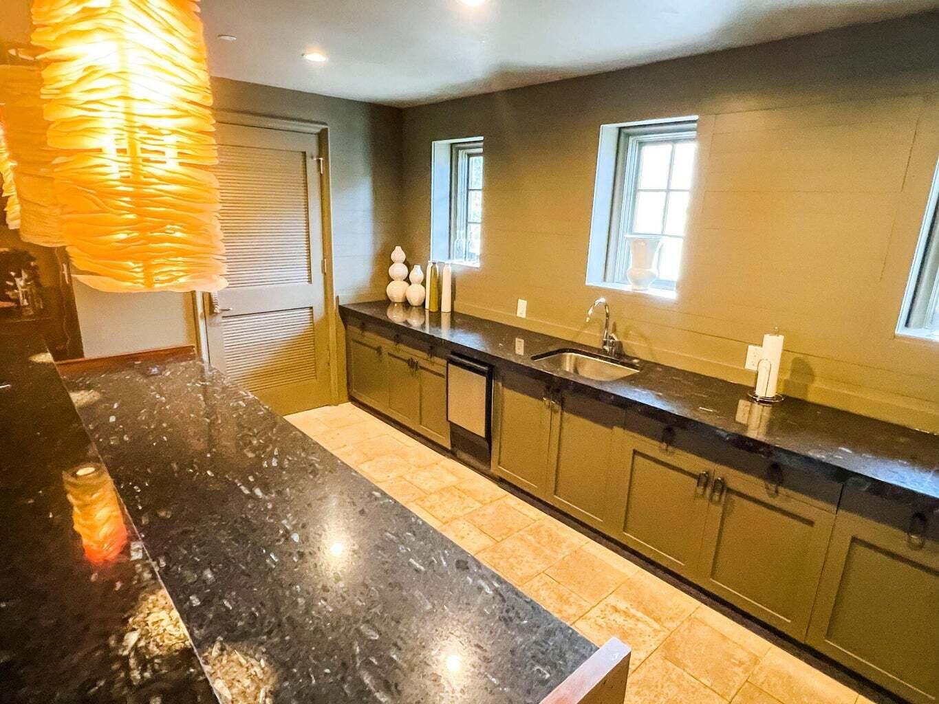 136 Georgetown Avenue, Unit 2C 5 Inlet Beach, FL 32461 - Photo 6 of 18 a view of a kitchen with stainless steel appliances granite countertop a sink and cabinets