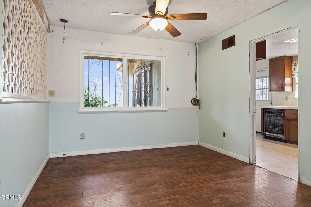 1430 Huntswood Way Oxnard, CA 93030 - Photo 3 of 12 a view of empty room with wooden floor and fan