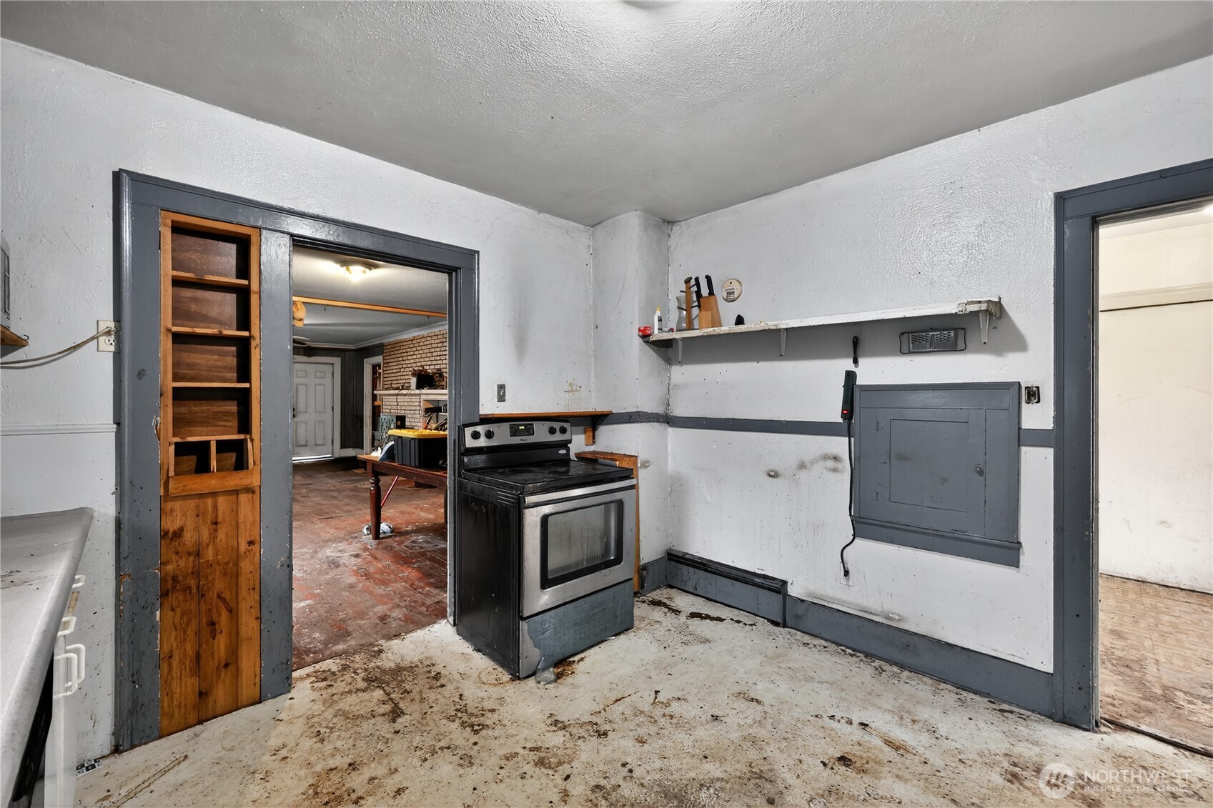 407 O Street Hoquiam, WA 98550 - Photo 15 of 31 a kitchen with stainless steel appliances granite countertop a stove a sink and a refrigerator
