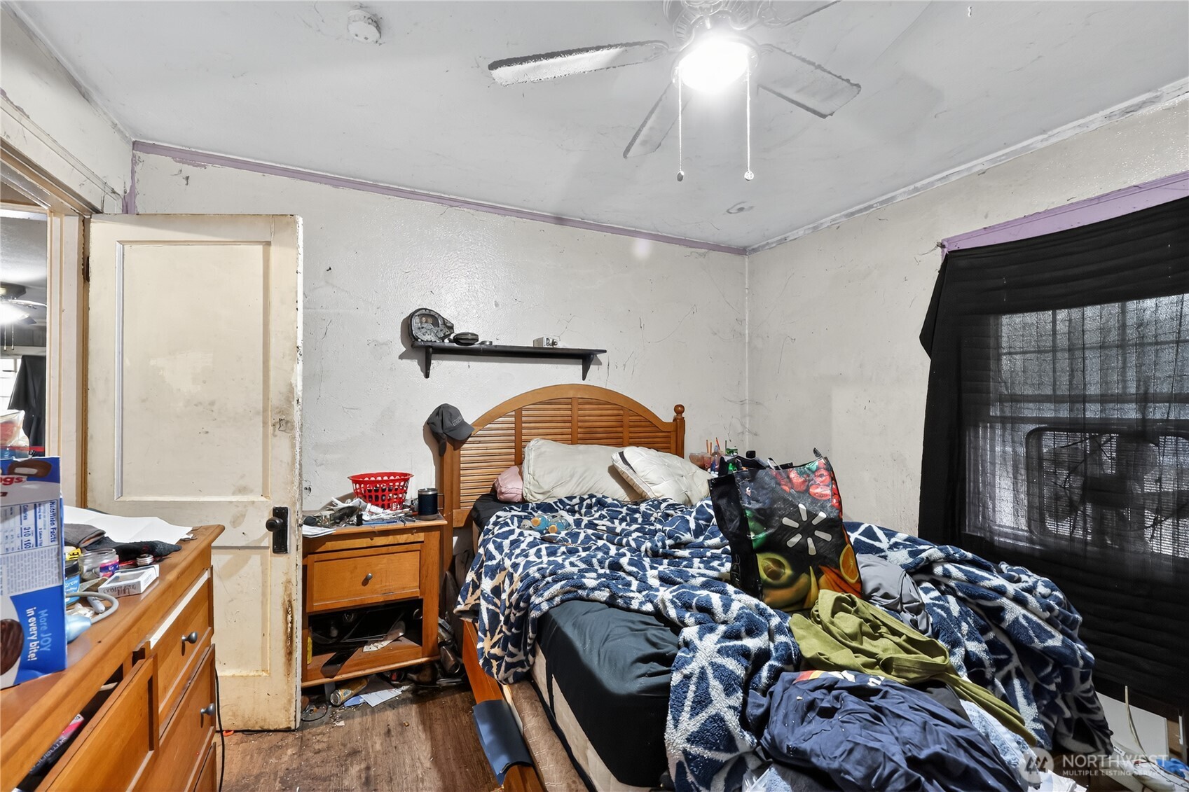 407 O Street Hoquiam, WA 98550 - Photo 21 of 31 a bedroom with a bed and a chandelier