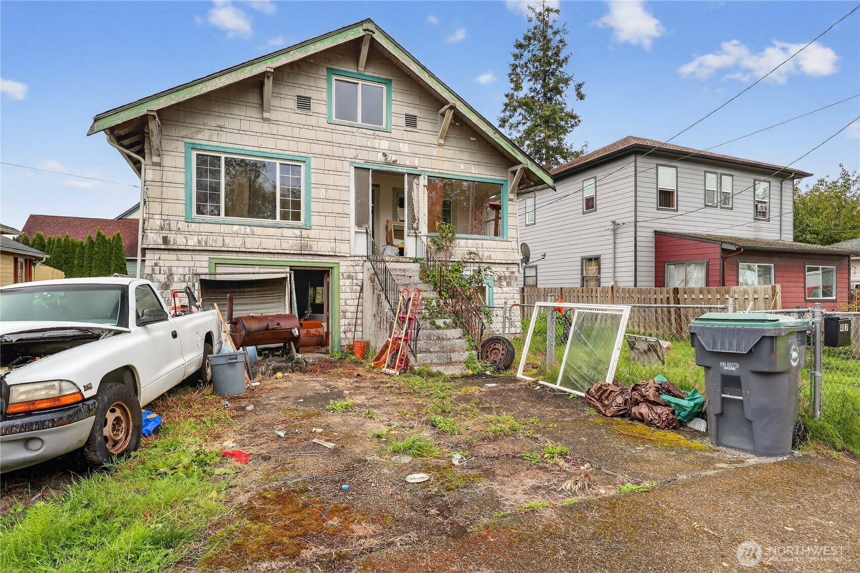 407 O Street Hoquiam, WA 98550 - Photo 3 of 31 a view of a house with a patio and a yard