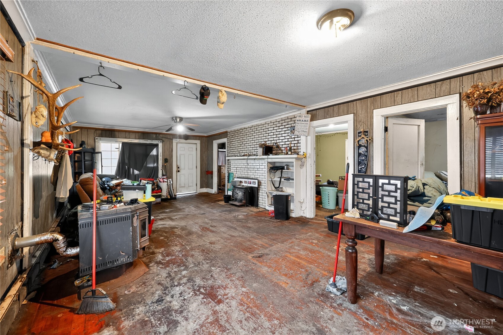 407 O Street Hoquiam, WA 98550 - Photo 5 of 31 a living room with furniture a fireplace and a flat screen tv