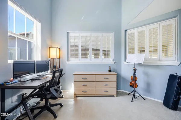 a bathroom with a shower a sink and a mirror