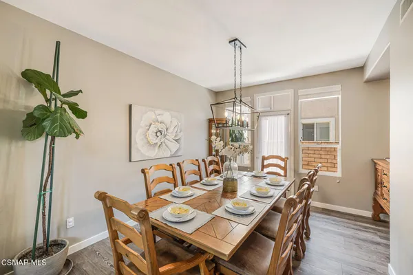 a view of a dining room with furniture window and outside view