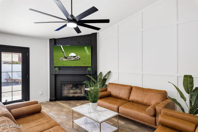 a living room with furniture and a window