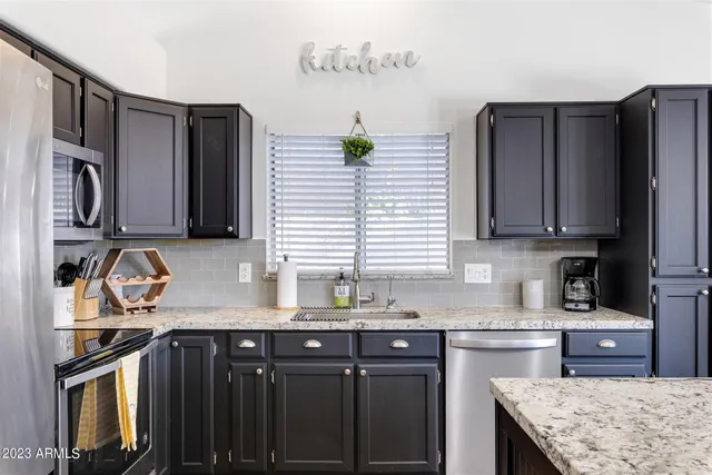 a bedroom with a bed and a ceiling fan