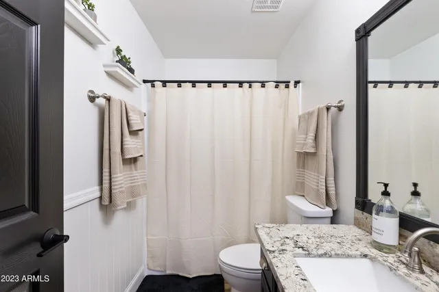a view of a potted plant with wooden floor