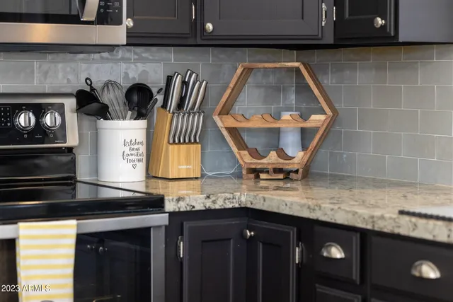 a view of a backyard with plants and a patio