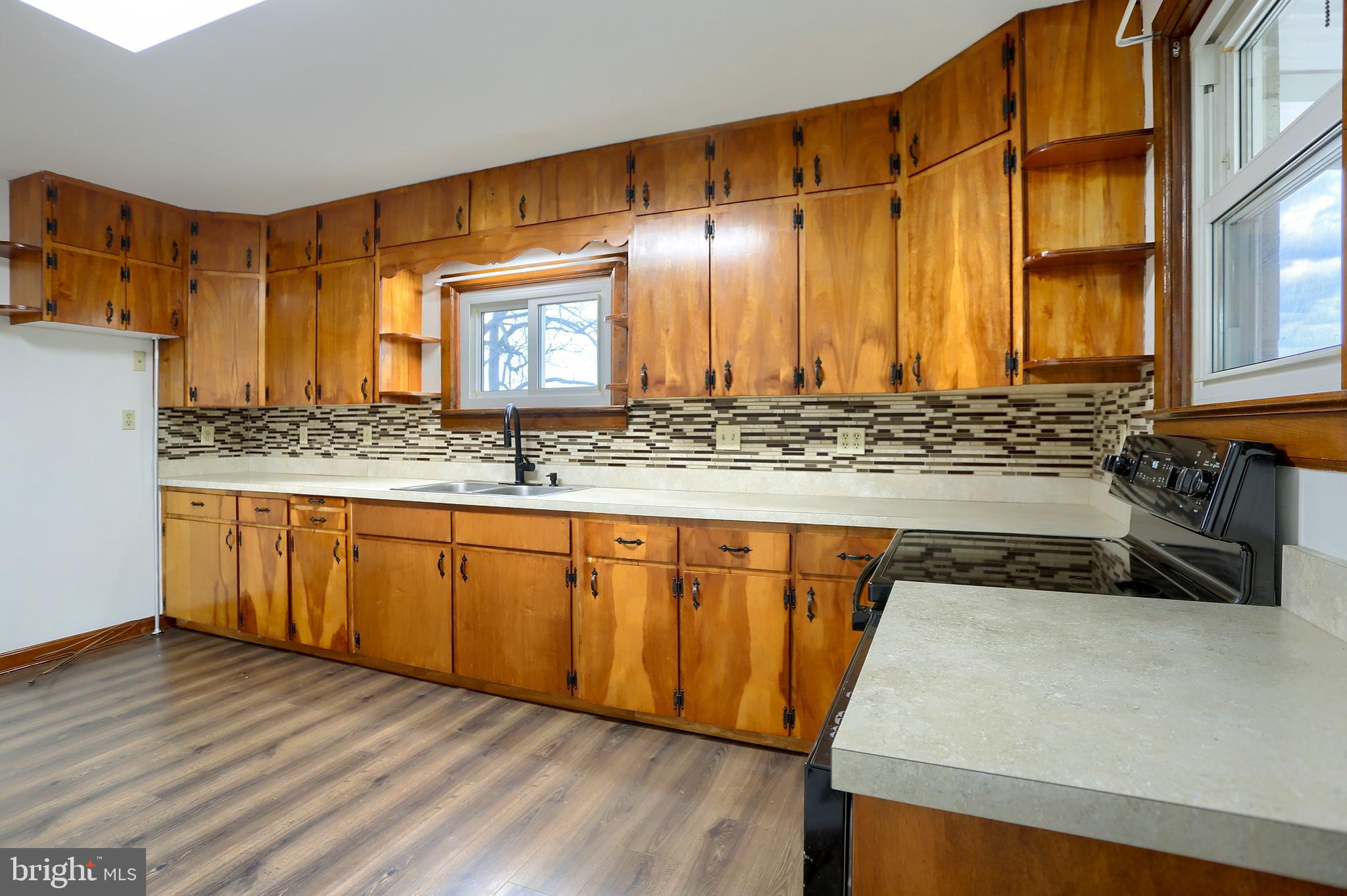 338 Locust Street Halifax, PA 17032 - Photo 12 of 43 a view of kitchen with stainless steel appliances granite countertop wooden cabinets a sink and dishwasher