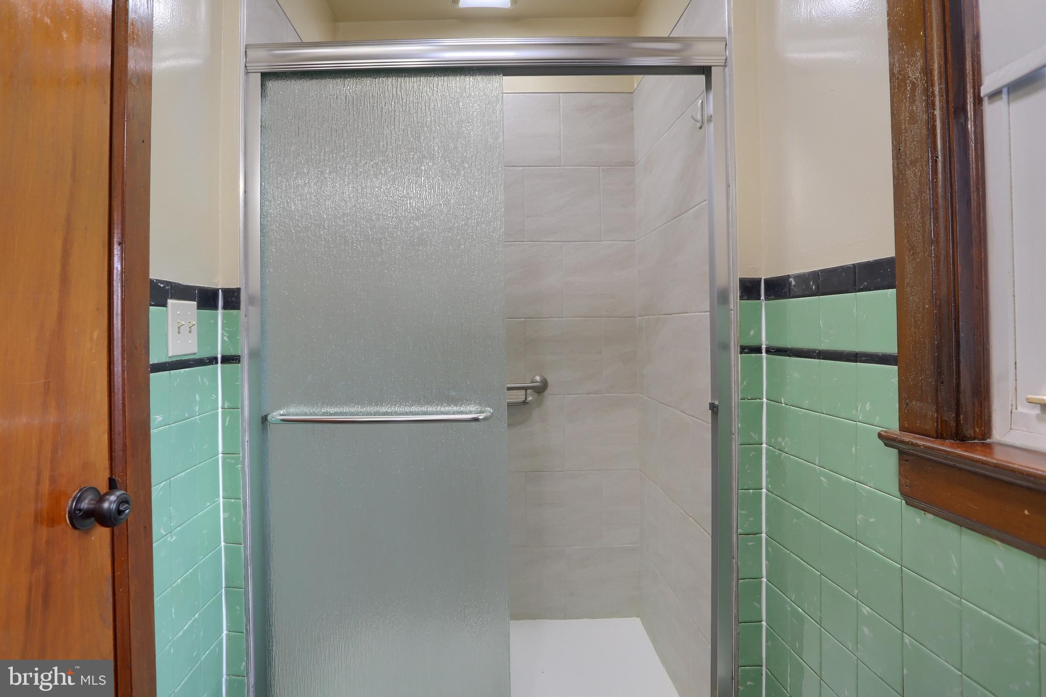 338 Locust Street Halifax, PA 17032 - Photo 15 of 43 a bathroom with a glass shower door