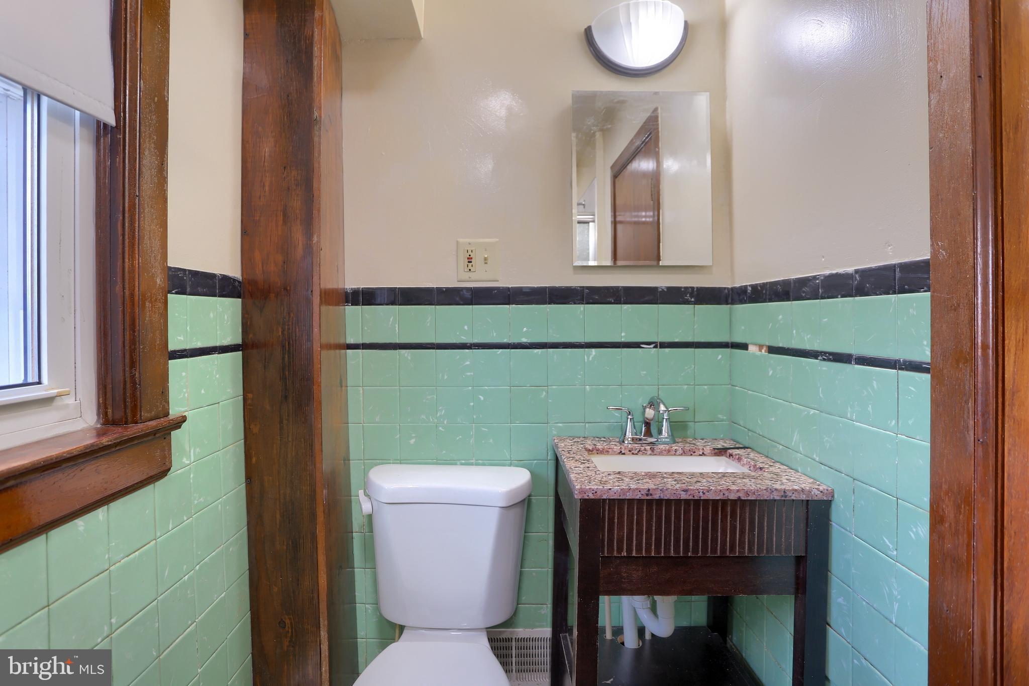 338 Locust Street Halifax, PA 17032 - Photo 16 of 43 a bathroom with a sink a mirror and a toilet