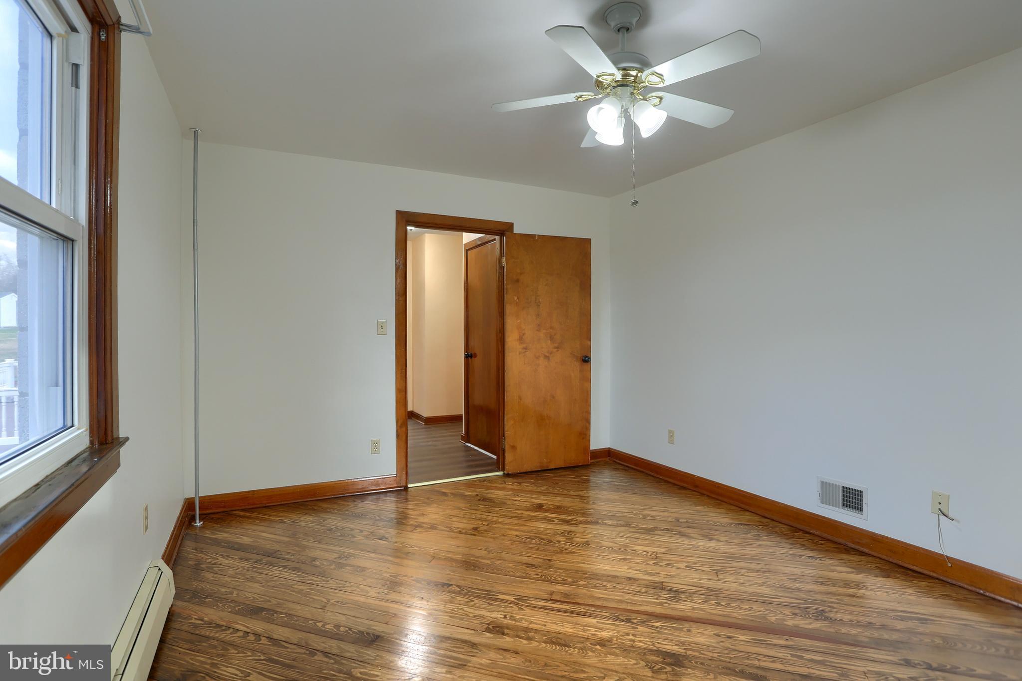 338 Locust Street Halifax, PA 17032 - Photo 18 of 43 a view of room with window and wooden floor