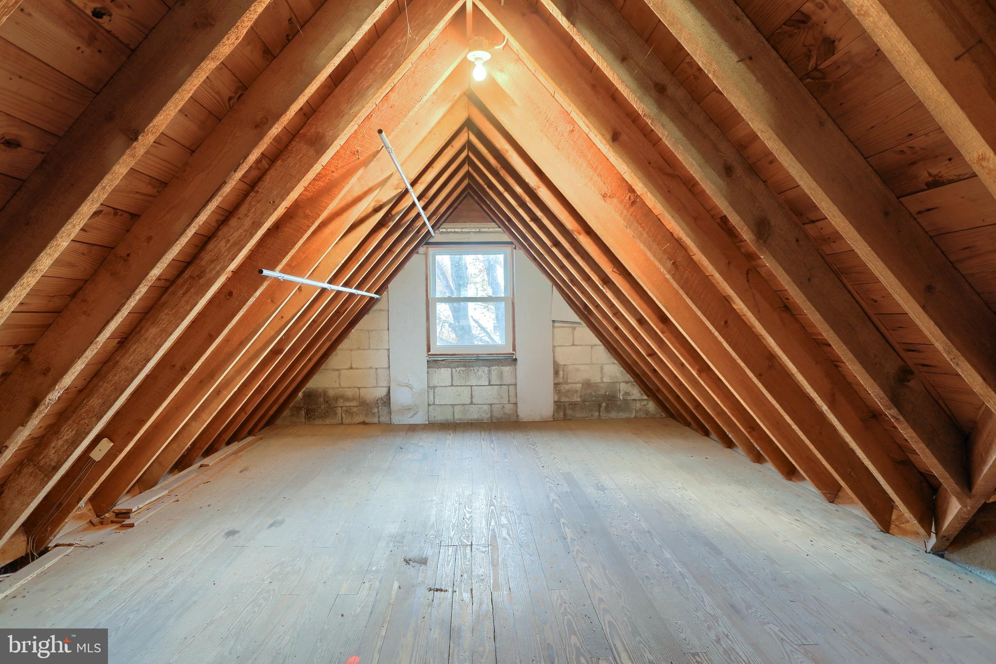 338 Locust Street Halifax, PA 17032 - Photo 25 of 43 a view of an empty room with wooden floor and stairs