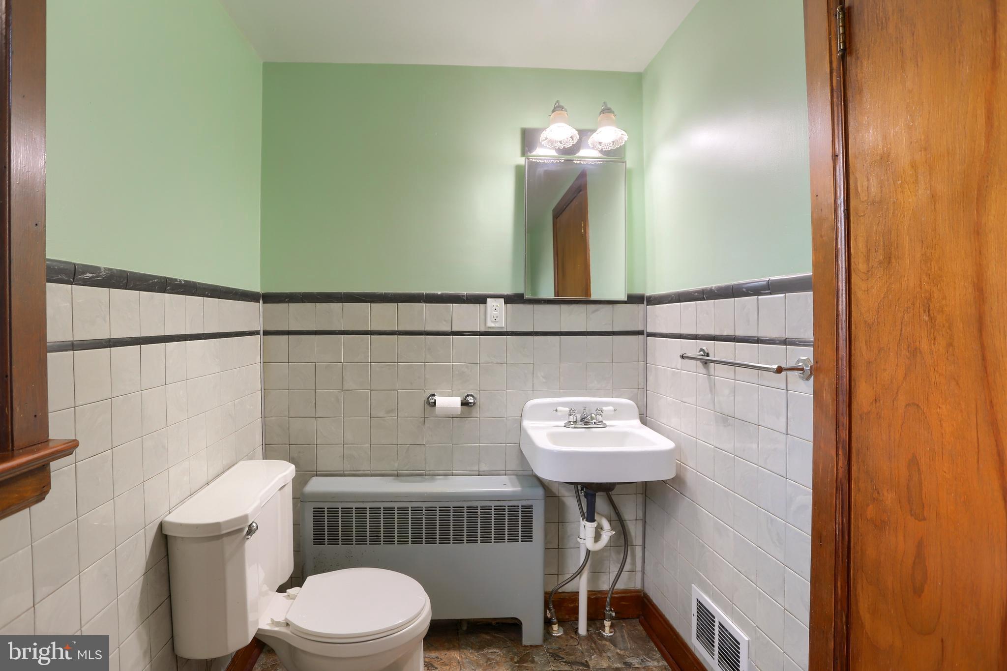 338 Locust Street Halifax, PA 17032 - Photo 27 of 43 a bathroom with a sink a toilet and mirror