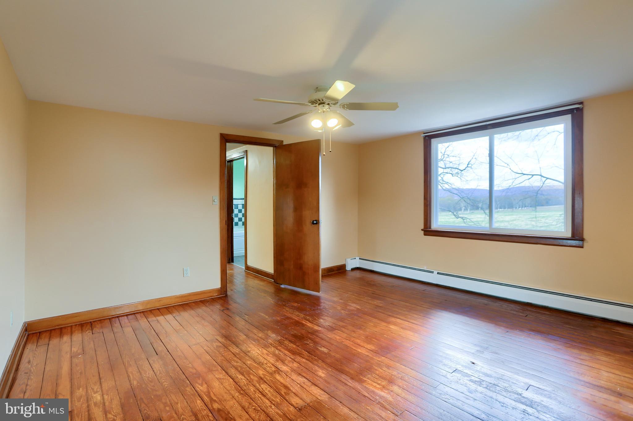 338 Locust Street Halifax, PA 17032 - Photo 32 of 43 an empty room with wooden floor and windows
