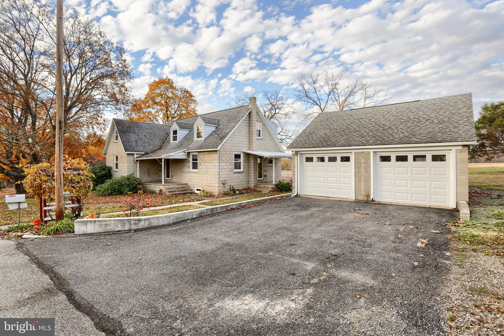 338 Locust Street Halifax, PA 17032 - Photo 42 of 43 a view of a house with a yard and garage