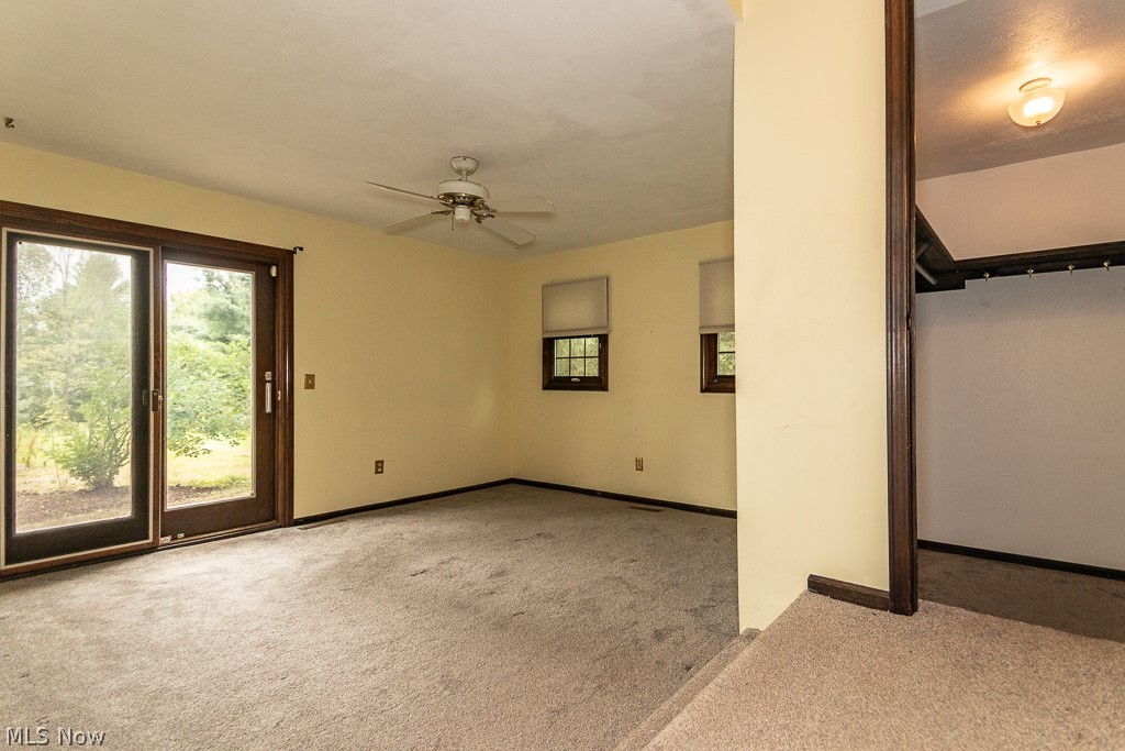 11601 Bass Lake Road Chardon, OH 44024 - Photo 21 of 50 Empty room with ceiling fan and carpet flooring