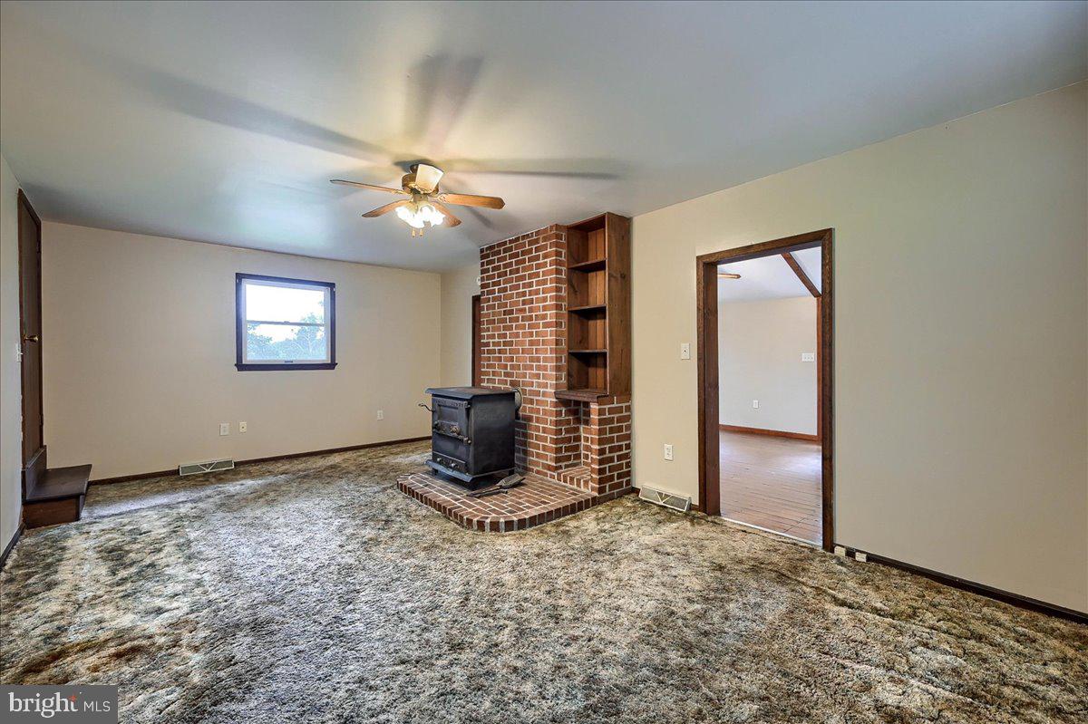 1887 Cider Press Road Manheim, PA 17545 - Photo 21 of 38 a view of an empty room with window and chandelier fan