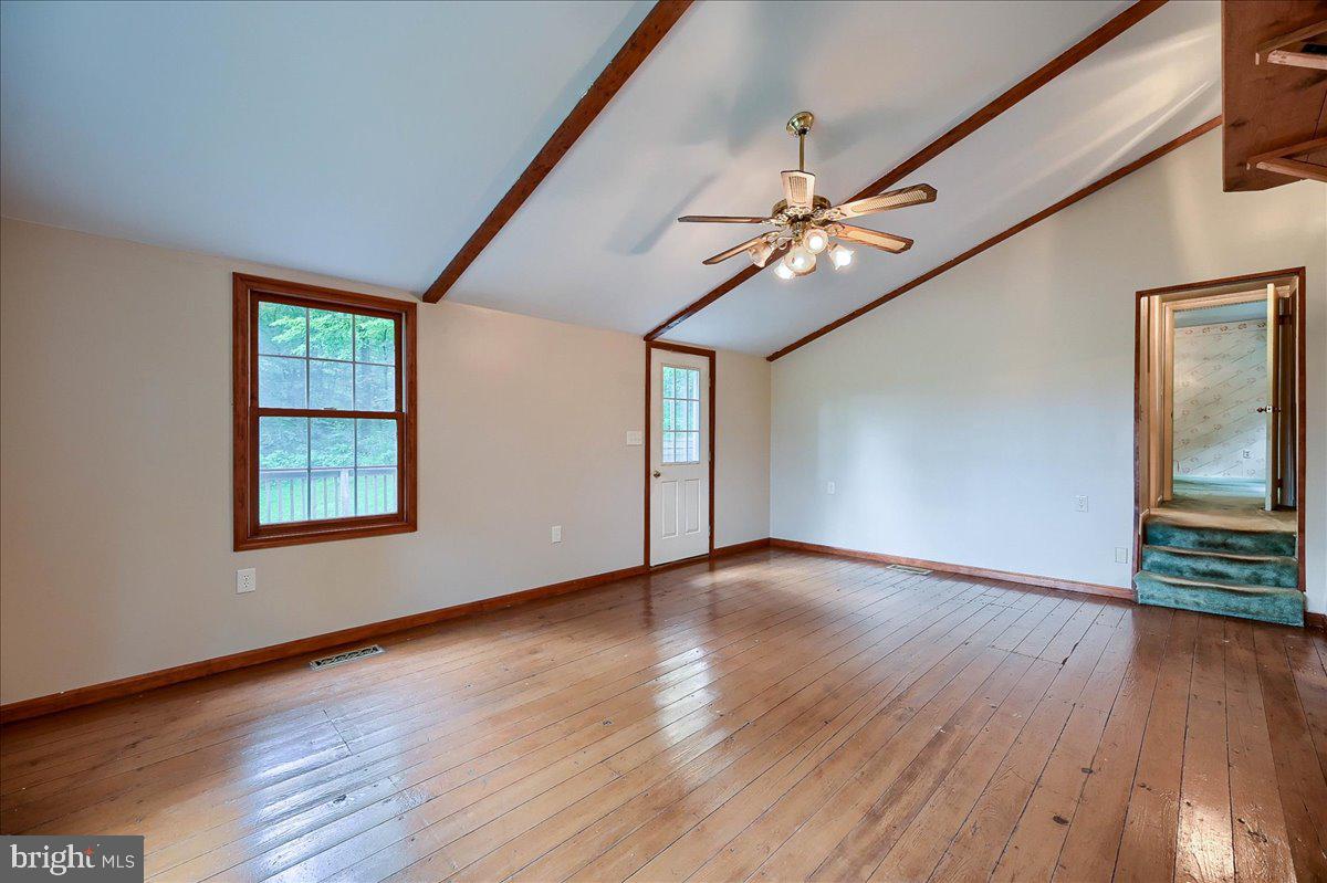 1887 Cider Press Road Manheim, PA 17545 - Photo 25 of 38 a view of an empty room with wooden floor and a window
