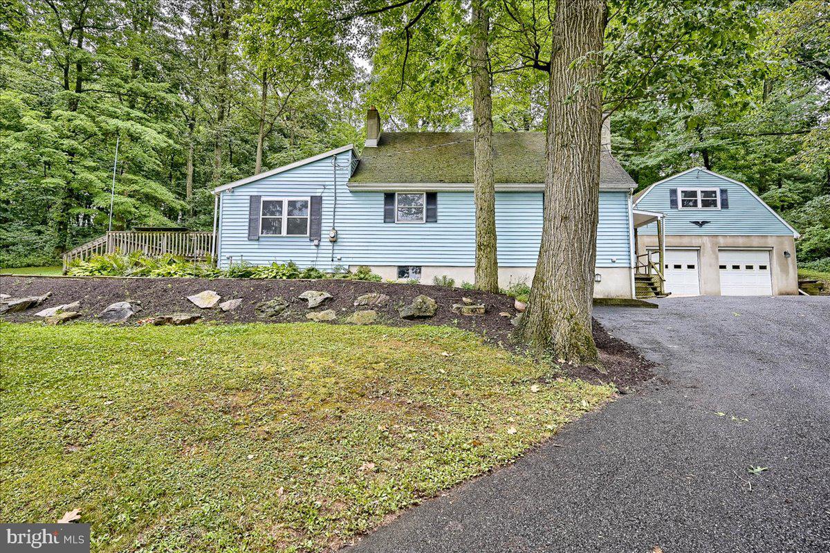 1887 Cider Press Road Manheim, PA 17545 - Photo 3 of 38 a front view of a house with garden