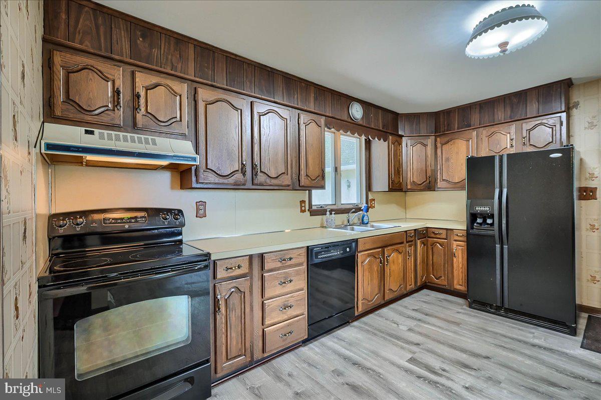 1887 Cider Press Road Manheim, PA 17545 - Photo 6 of 38 a kitchen with stainless steel appliances granite countertop a stove and a refrigerator