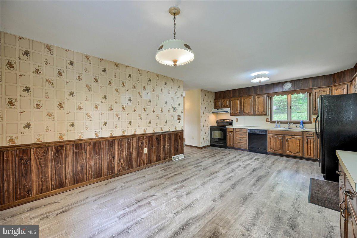 1887 Cider Press Road Manheim, PA 17545 - Photo 8 of 38 a large kitchen with cabinets wooden floor and stainless steel appliances