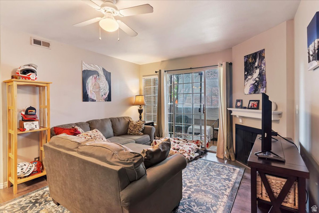 650 South Main Street, Unit 4104 Bountiful, UT 84010 - Photo 5 of 22 Living room featuring ceiling fan, wood finished floors, and a fireplace